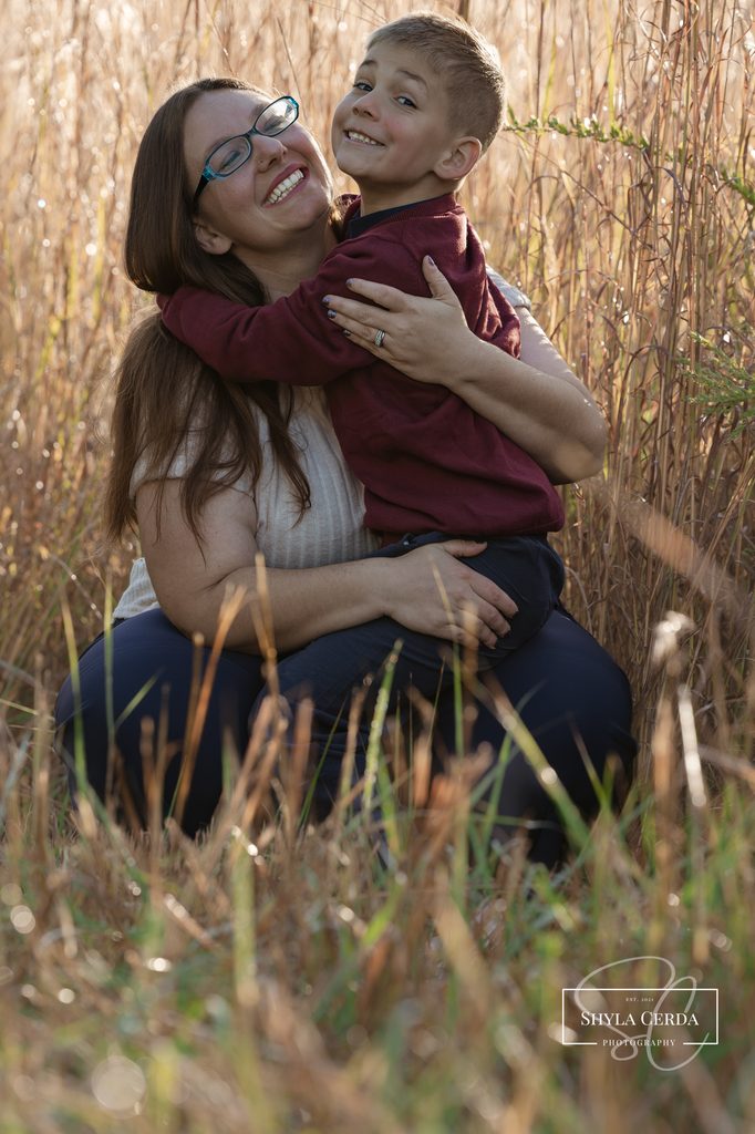 Mom and son laughing during their family session